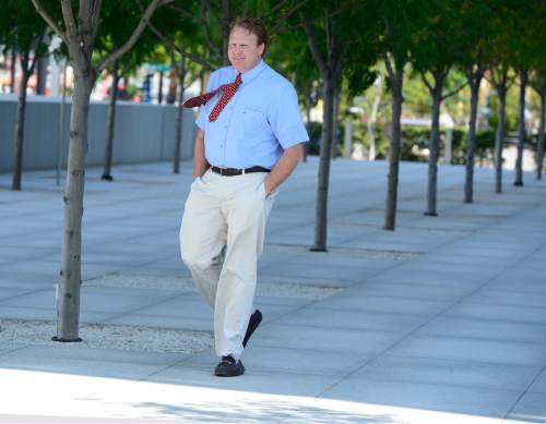 Scott Sommerdorf   |  The Salt Lake Tribune
Jeremy Johnson leaves the federal courhouse after a hearing in which he chose to be represented by attorneys Greg Skordas and Rebecca Skordas, Wednesday, July 22, 2015.
