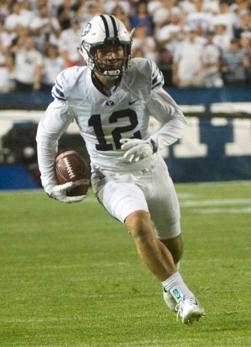 Rick Egan  |  The Salt Lake Tribune

Brigham Young defensive back Kai Nacua (12) runs the ball back after making an interception in the 4th quarter for the Cougars, in college football action, BYU vs. Boise State at Lavell Edwards Stadium, Saturday, September 12, 2015.