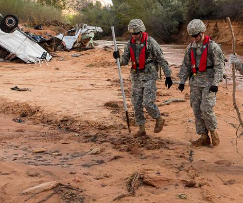 Trent Nelson  |  The Salt Lake Tribune
Members of the Utah National Guard search the Short Creek Wash in Hildale, Wednesday September 16, 2015. The Utah National Guard and law enforcement on Wednesday resumed searching for the last known victim of a flash flood that tore through this polygamous border town home to followers of Warren Jeffs, leaving 13 dead and three injured, all of them women and children.