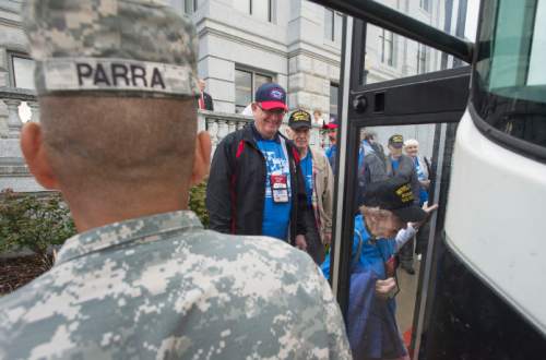 Steve Griffin  |  The Salt Lake Tribune

WWll and Korean War veterans board buses to the airport following a morning briefing at the Utah State Senate Building. The vets were participating in a Utah Honor Flight departing from Salt Lake City, Thursday, September 17, 2015. The flight shuttled World War ll and Korean War Veterans to Washington, D.C., where they will be given the opportunity to view memorials erected in memory of their service.  The Utah House of Representatives raised $35,000 to sponsor the flight so the veterans could participate free of cost.