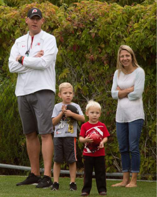 Steve Griffin  |  The Salt Lake Tribune

University of Utah football co-offensive coordinator Jim Harding watches the end of practice wind with his wife Meredith and their two sons Colton and Jackson at the Eccles Football Center on the University of Utah campus in Salt Lake City, Tuesday, September 15, 2015.