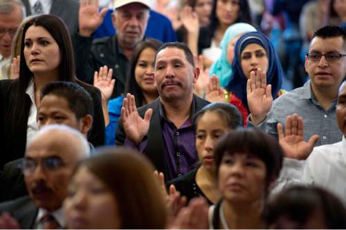 Steve Griffin  |  The Salt Lake Tribune

140 people become new citizens of the United States of America as they take the Oath of Allegiance during a citizenship ceremony hosted by the U.S. Citizenship and Immigration Services at This Is The Place Heritage Park in Salt Lake City, Thursday, September 17, 2015. The 140 people from over 40 countries became citizens as they took the Oath of Allegiance.