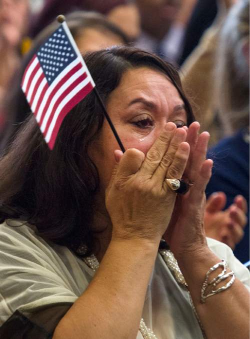 Steve Griffin  |  The Salt Lake Tribune

New United States of America citizen Blanca Zapata wipes tears form her eyes as she listens to the song "Proud to be an American" during a citizenship ceremony hosted by the U.S. Citizenship and Immigration Services at This Is The Place Heritage Park in Salt Lake City, Thursday, September 17, 2015. Zapata was joined by 139 other immigrants who become new citizens of the United States of America after taking the Oath of Allegiance.