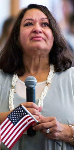 Steve Griffin  |  The Salt Lake Tribune

New United States of America citizen Blanca Zapata cries as she tells her story of emigrating from Venezula during a citizenship ceremony hosted by the U.S. Citizenship and Immigration Services at This Is The Place Heritage Park in Salt Lake City, Thursday, September 17, 2015. Zapata was joined by 139 other immigrants who become new citizens of the United States of America after taking the Oath of Allegiance. New citizens are invited to stand and tell of their lives during the event.