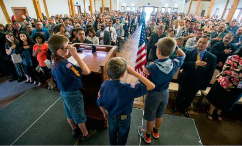 Steve Griffin  |  The Salt Lake Tribune

Scouts from Daybreak Elementary School lead 140 new citizen candidates and their families in the Pledge of Allegiance during a citizenship ceremony hosted by the U.S. Citizenship and Immigration Services at This Is The Place Heritage Park in Salt Lake City, Thursday, September 17, 2015. The 140 people from over 40 countries became citizens as they took the Oath of Allegiance.