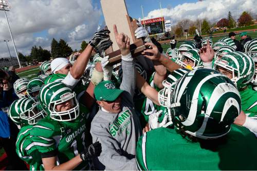 Scott Sommerdorf  |  The Salt Lake Tribune
South Summit players and coaches celebrate winning the 2A title. South Summit won the 2A state championship after beating Summit Academy 28-6 in Cedar City, Friday, November 14, 2014.