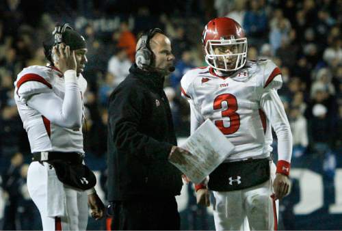 Scott Sommerdorf  |  Salt Lake Tribune

Utah QB Jordan Wynn (right; #3) talks with offensive coordinator Dave Schramm prior to the 2-point conversion that made the score 20-17 BYU late in the 4th quarter. QB Terrance Cain is at left. 
BYU defeated Utah 26-23, Saturday November 28, 2009.