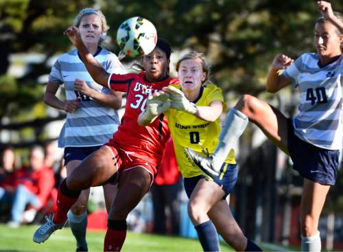 Scott Sommerdorf   |  The Salt Lake Tribune
USU goalkeeper Jeannie Woller keeps her eyes on a shot as Utah's Mariah Elmer tries to get to a corner kick during second half play. Utah State beat Utah 2-0 in women's soccer at Utah, Friday, September 18, 2015.