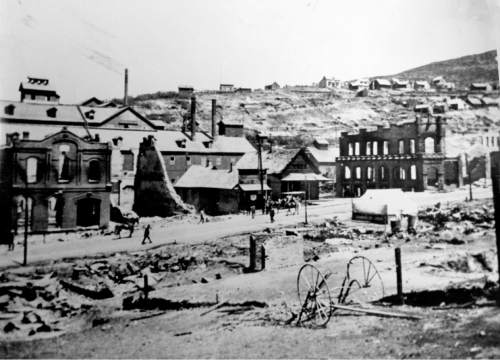 Salt Lake Tribune Archive

Pedestrians walk past the remains of Park City's City Hall, with Marsac Mill in the background, after the 1898 fire.