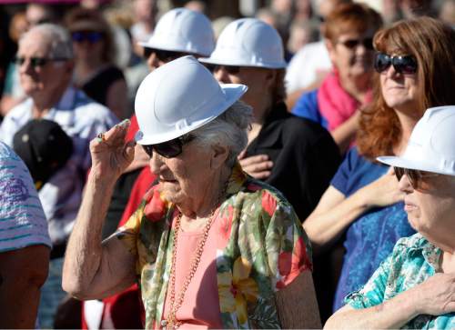 Al Hartmann  |  The Salt Lake Tribune
Assembled crowd observes the American flag ceremony at The Carbon County Coal Miners' Memorial that was unveiled and dedicated Monday September 7 to coal miners that  died in accidents since the inception of mining in the 1880's.  Two statues and several large plaques with 1,400 names of fallen miners now resides in the Price Peace Park along Main Street.