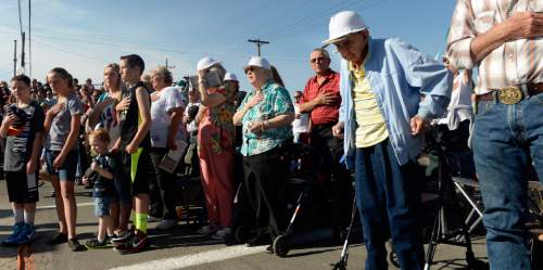 Al Hartmann  |  The Salt Lake Tribune
Assembled crowd  observes the American flag ceremony at The Carbon County Coal Miners' Memorial that was unveiled and dedicated Monday September 7 to coal miners that  died in accidents since the inception of mining in the 1880's.  Two statues and several large plaques with 1,400 names of miners now resides in the Price Peace Park along Main Street.