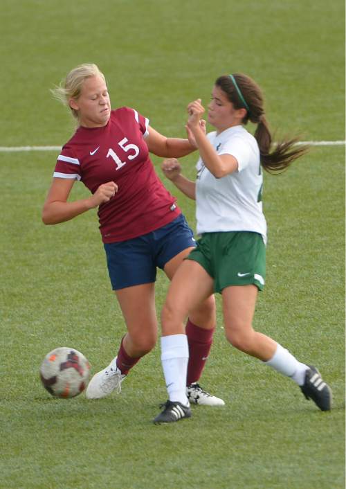 Leah Hogsten  |  The Salt Lake Tribune
Waterford's #15 and Rowland Hall's #27 fight for possession. Rowland Hall girls soccer team hosted Waterford School, September 17, 2015.