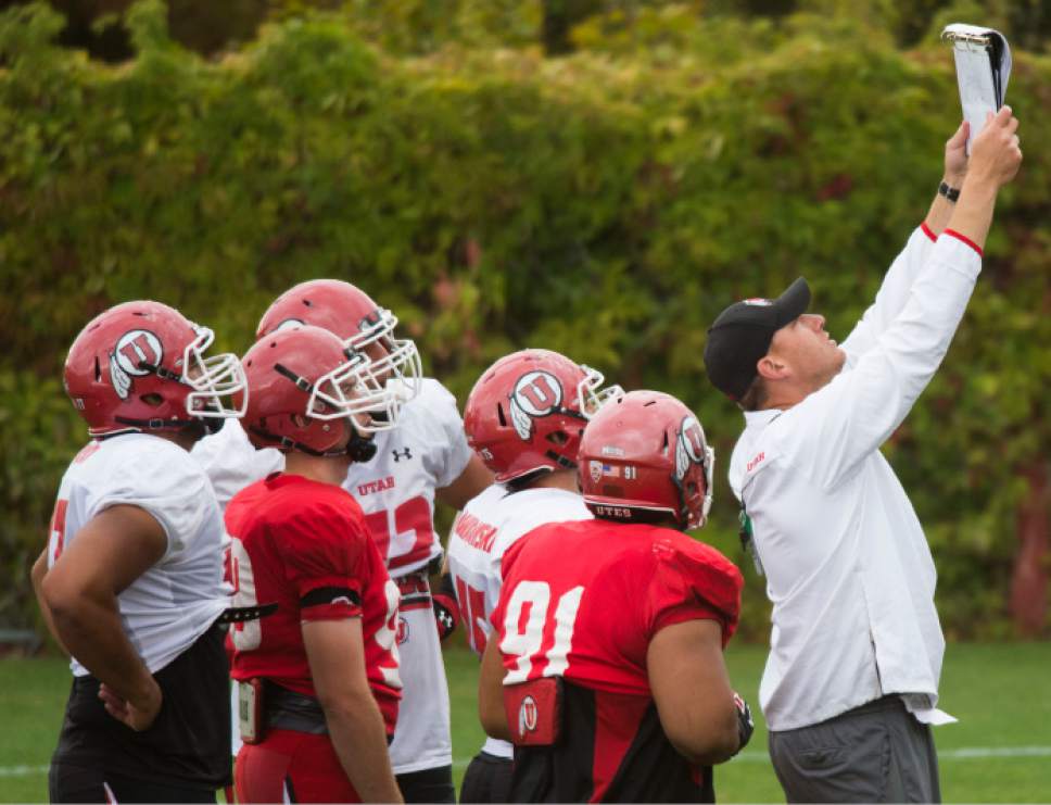 Steve Griffin  |  The Salt Lake Tribune

University of Utah football co-offensive coordinator Jim Harding holds up a play during practice at the Eccles Football Center on the University of Utah campus in Salt Lake City, Tuesday, September 15, 2015.
