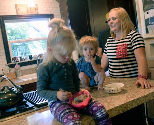 Al Hartmann  |  The Salt Lake Tribune
Anna Reeder gets her daughters Mitzi, 15 months, and and Cora, 4,  breakfast to start the day at their home in Logan.  The family participates in the National Children's Study, a much trumpeted nationwide study that was supposed to involve thousands of American children. The University of Utah was one of the research sites, and it enlisted hundreds of Utah families to help. But the national study was disbanded last winter. Now, the U. researchers are going ahead with the Utah Children's Study, and the Reeder family is one of the families in which the children's health is being carefully monitored.