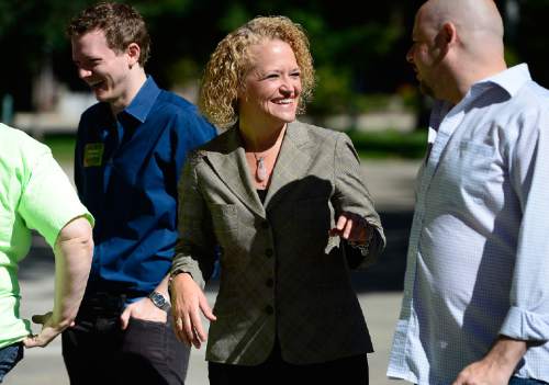Scott Sommerdorf   |  The Salt Lake Tribune
Mayoral candidate Jackie Biskupski speaks with supporters after she was endorsed by various representatives from the Utah LGBT community on the east steps of City Hall, Sunday, September 20, 2015.