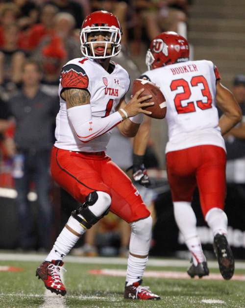 Utah quarterback Kendal Thompson drops back to pass against Fresno State during the first half of an NCAA college football game in Fresno, Calif., Saturday, Sept. 19, 2015. (AP Photo/Gary Kazanjian)
