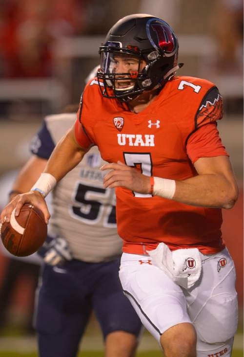 Leah Hogsten  |  The Salt Lake Tribune
Utah Utes quarterback Travis Wilson (7) runs out of the pocket. University of Utah is tied with Utah State 14-14 at halftime at Rice-Eccles Stadium, Friday, September 11, 2015.