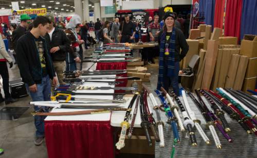 Steve Griffin  |  The Salt Lake Tribune

Fans check out swords during the opening day of the Salt Lake Comic Con Fan Experience at the Salt Palace Convention Center in Salt Lake City, Thursday, January 29, 2015.