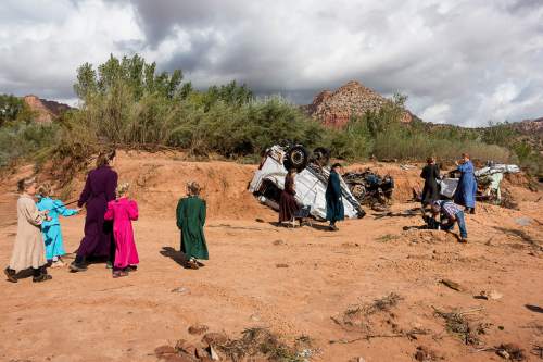 Trent Nelson  |  The Salt Lake Tribune
A group of FLDS women approach the scene of a flash flood incident, Wednesday September 16, 2015.
