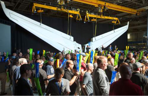 Steve Griffin  |  The Salt Lake Tribune

With Boeing's first all Utah built 787-9 horizontal stabilizer (tail) in the background employees cheer the completion of the tail during an event at the Boeing Fabrication Salt Lake facility Friday, September 25, 2015.