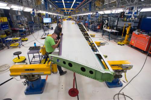 Steve Griffin  |  Tribune file photo

Mechanics work on a vertical fin assembly for a Boeing 787 Dreamliner at Boeing in Salt Lake City, Thursday, September 3, 2015.