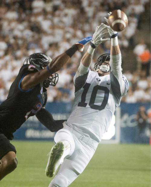 Rick Egan  |  The Salt Lake Tribune

Brigham Young Cougars wide receiver Mitch Mathews (10) lets the pass slip through his hands, as Boise State Broncos cornerback Jonathan Moxey (2) defends, in college football action, BYU vs. Boise State at Lavell Edwards Stadium, Saturday, Sept. 12, 2015.