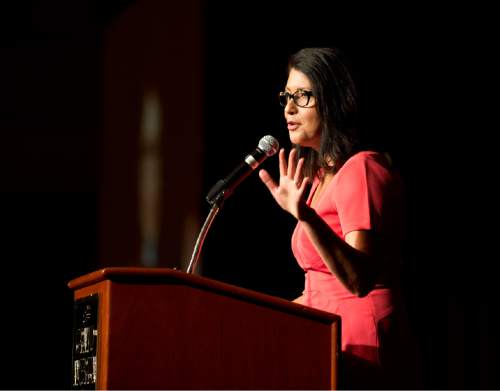 Lennie Mahler  |  The Salt Lake Tribune

KUTV News reporter Cristina Flores welcomes guests to the YWCA Leader Luncheon at the Grand America Hotel in Salt Lake City. Friday, Sept. 25, 2015.