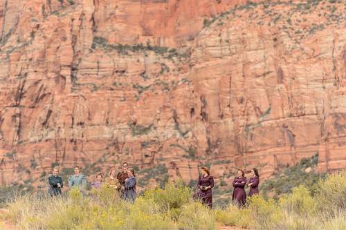 Trent Nelson  |  The Salt Lake Tribune
Women arrive at a memorial for the 13 (and 1 still missing) victims of a September 14th flash flood. The memorial was held in Maxwell Park in Hildale, Saturday September 26, 2015.