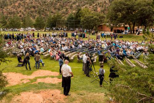 Trent Nelson  |  The Salt Lake Tribune
Attendees at a memorial for the 13 (and 1 still missing) victims of a September 14th flash flood. The memorial was held in Maxwell Park in Hildale, Saturday September 26, 2015.