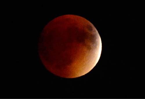 Scott Sommerdorf   |  The Salt Lake Tribune
The "Blood Moon" eclipse as seem from Millcreek, Sunday, September 26, 2015.