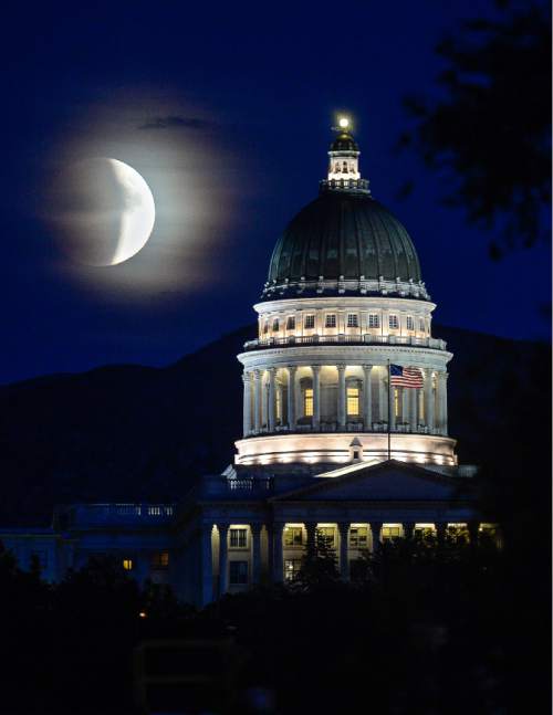 Francisco Kjolseth | The Salt Lake Tribune
A rare super moon lunar eclipse, begins its transformation behind the Utah State Capitol in Salt Lake City on Sunday, Sept. 27, 2015.