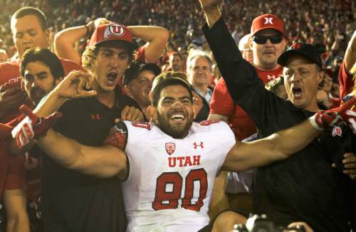 Rick Egan  |  The Salt Lake Tribune

Utah Utes tight end Westlee Tonga (80) celebrates with Utah fans, as the Utes held on for a 30-28 upset over UCLA, in Pac 12 action, at the Rose Bowl, Saturday, October 4, 2014