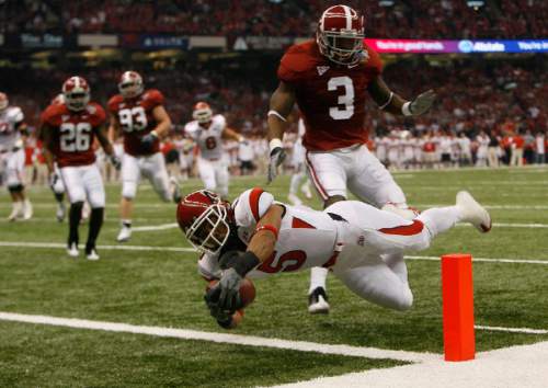 Chris Detrick | The Salt Lake Tribune

Utah wide receiver Brent Casteel (5) dives into the endzone past Alabama cornerback Kareem Jackson (3) to score the first touchdown of the game as the Utes face Alabama in the 75th Anniversary Sugar Bowl in New Orleans, Louisiana, Friday, January 2, 2008.