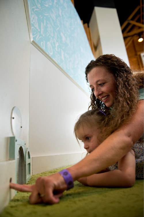 Lennie Mahler  |  The Salt Lake Tribune

Kami Hepworth and her daughter, Ava, look into the mouse house at Discovery Gateway Children's Museum on Friday, Sept. 25, 2015.