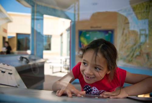 Lennie Mahler  |  The Salt Lake Tribune

Haylie An communicates with kids in the IHC Life Flight helicopter on the balcony at Discovery Gateway Children's Museum on Friday, Sept. 25, 2015.