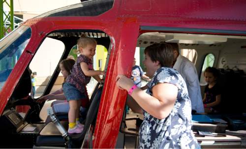 Lennie Mahler  |  The Salt Lake Tribune

Lynzi Hansen, right, plays with her daughter, Millie, in the IHC Life Flight helicopter at Discovery Gateway Children's Museum on Friday, Sept. 25, 2015.