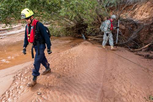 Trent Nelson  |  The Salt Lake Tribune
Searchers from Utah Task Force One and the Utah National Guard comb a wash, looking for the remaining victim of a flash flood, in Hildale, Wednesday September 16, 2015.