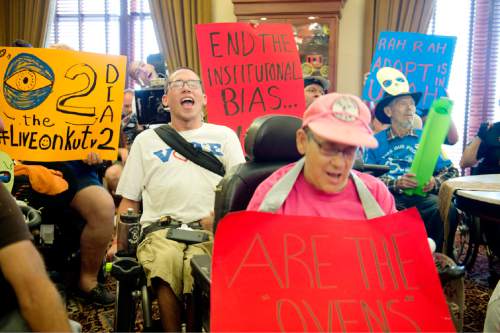 Rich Kane  |  The Salt Lake Tribune

Disability rights activists from the group ADAPT demonstrate inside Gov. Herbert's office Tuesday afternoon September 29, 2015. The group is calling for the governor to back the Community First Choice Option of the Affordable Care Act, which would make it easier for people with disabilities to stay in their homes.