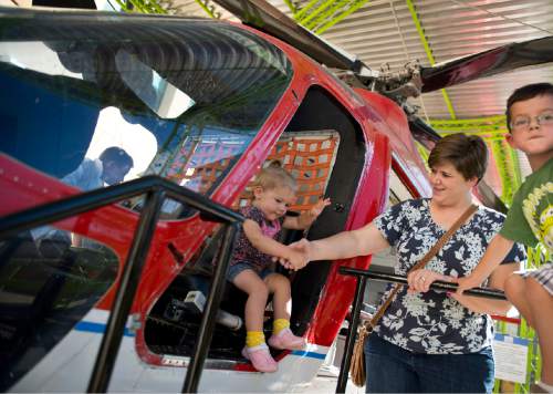 Lennie Mahler  |  The Salt Lake Tribune

Lynzi Hansen, right, helps her daughter, Millie, get out of the IHC Life Flight helicopter at Discovery Gateway Children's Museum on Friday, Sept. 25, 2015.