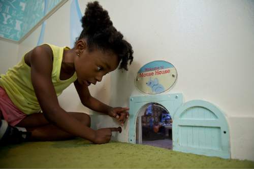 Lennie Mahler  |  The Salt Lake Tribune

A girl looks into the mouse house at Discovery Gateway Children's Museum on Friday, Sept. 25, 2015.