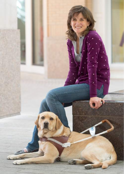 Rick Egan  |  The Salt Lake Tribune

Becky Andrews with her third guide dog, named Georgie, in downtown Salt Lake City, Wednesday, August 12, 2015.