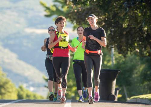 Rick Egan  |  The Salt Lake Tribune

Becky Andrews on an early morning run with her running friends Alanna Whetsel, Brenda Petersen and Suzette Hirst. Thursday, July 30, 2015.