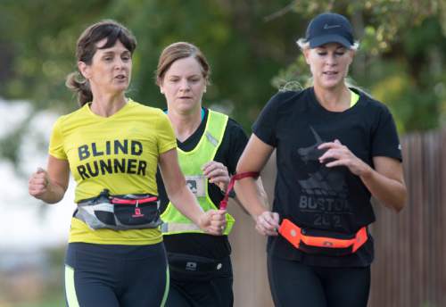 Rick Egan  |  The Salt Lake Tribune

Becky Andrews runs with Brenda Petersen and  Suzette Hirst nearly everyday, in their Bountiful neighborhood. Tuesday, August 4, 2015.