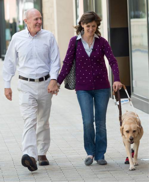 Rick Egan  |  The Salt Lake Tribune

Steve Andrews walks with Becky and her dog Georgie, in downtown Salt Lake City, Wednesday, August 12, 2015.