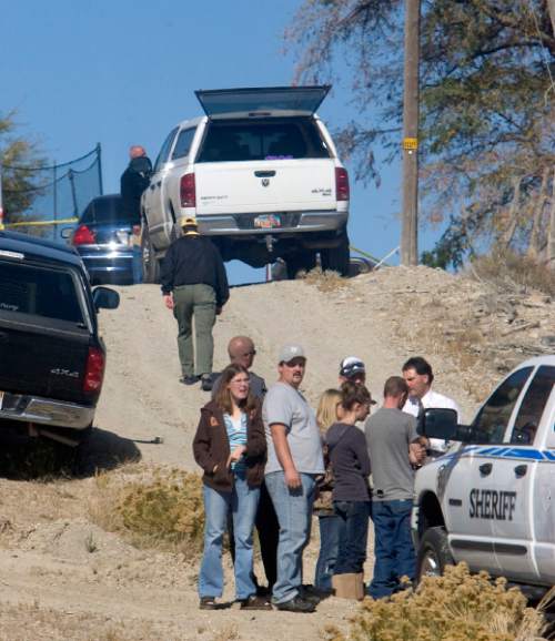 Al Hartmann  |  The Salt Lake Tribune

Emery County Sheriff department members block the lane leading to the house where Peter Sharp killed his father and mother William and Charmane Sharp in Castle Dale on Wednesday October 21, 2010.