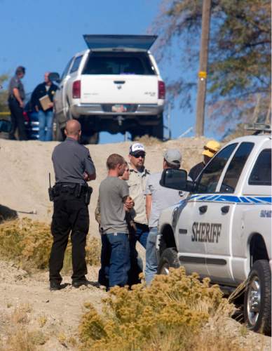 Al Hartmann  |  The Salt Lake Tribune

Emery County Sheriff department members block the lane leading to the house where Peter Sharp killed his father and mother William and Charmane Sharp in Castle Dale on Wednesday October 21, 2010.