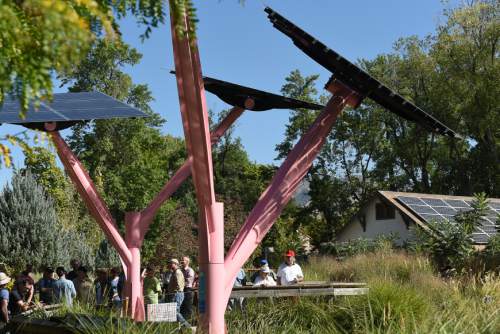 Francisco Kjolseth | The Salt Lake Tribune
Tracy Aviary shows off their new solar trees in the flamingo habitat as well as the solar panels on an adjacent building as Rocky Mountain Power hosts a tours to tout its Blue Sky clean energy program.