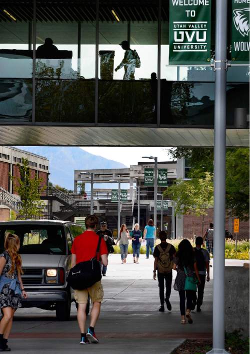 Scott Sommerdorf   |  The Salt Lake Tribune
Students walk to classes near the Liberal Arts Building at UVU, October 26, 2015.