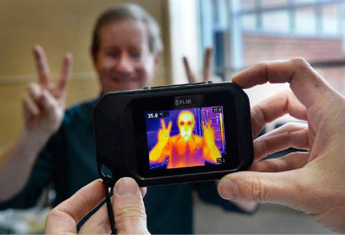 Scott Sommerdorf   |  The Salt Lake Tribune
Professor Phil Matheson is seen through an infared imaging device during the College of Science & Health Dean Day. There were interactive exhibits, giveaways to show students what the College of Science & Health has to offer at UVU, October 26, 2015.