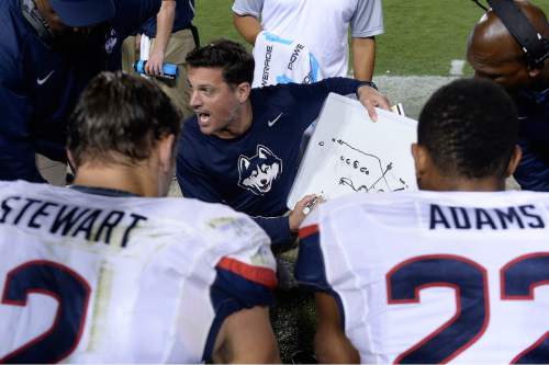 Scott Sommerdorf   |  The Salt Lake Tribune
Connecticut head coach Bob Diaco diagrams a play for his defense during second half play. Connecticut linebacker Graham Stewart (2)BYU beat UCONN 30-13, Friday, October 2, 2015.